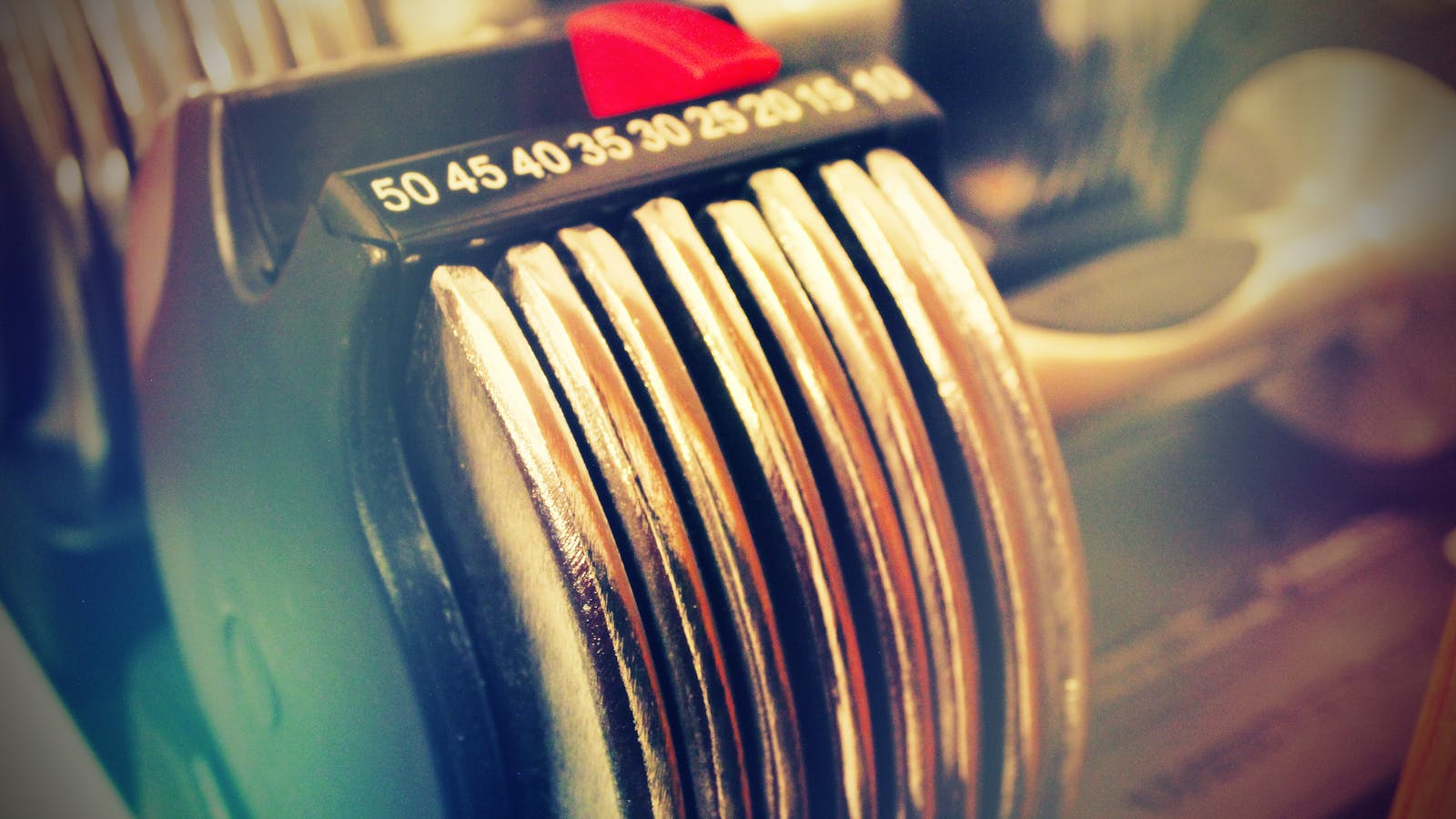 Close-up of adjustable dumbbells for a compact strength workout.