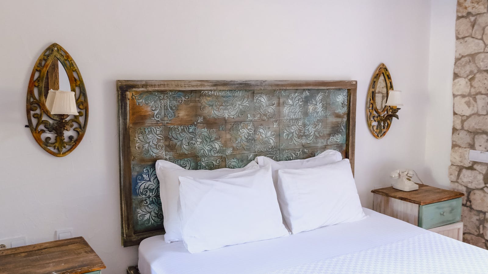 White mattress and pillows on a clean bed.